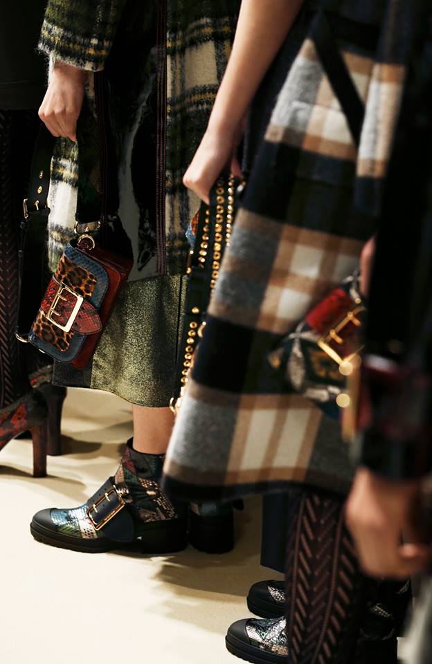 Check coats, The Patchwork and The Buckle Boot line up backstage at the Burberry show