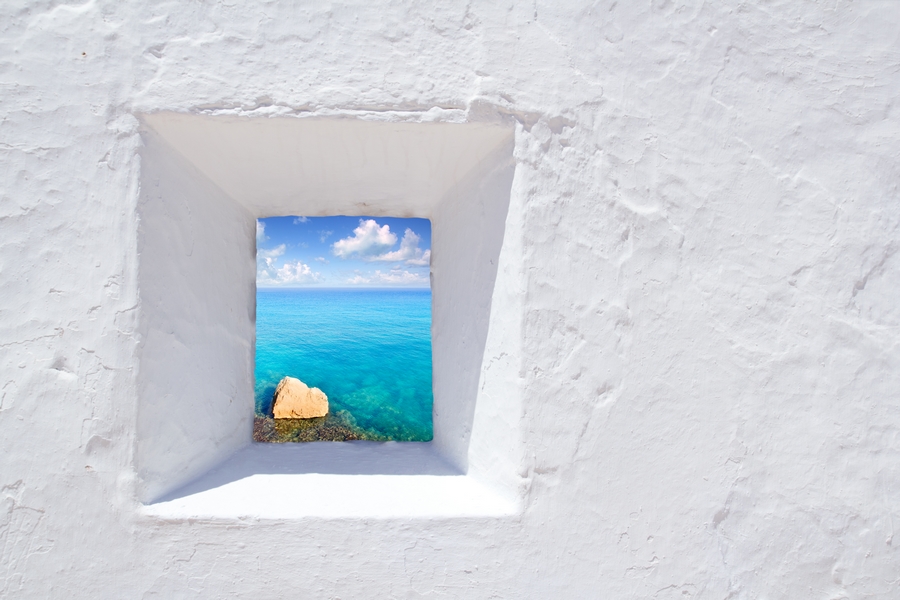Europe_Spain_Ibiza_Mediterranean white wall window in Formentera beach_attraction_beach_luxury_resort.jpg