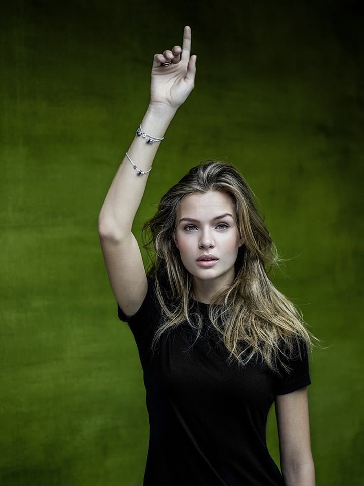 Model Josephine Skriver raises her hand for Save the Children and Bulgari