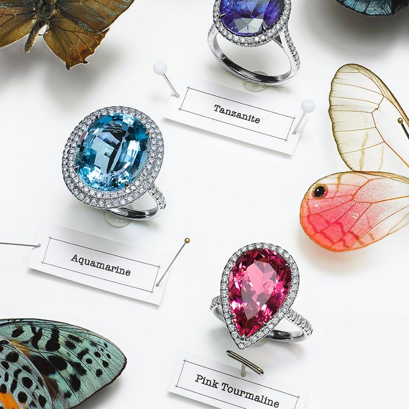 A pear-shaped pink tourmaline keeps company with cool aquamarine and tanzanite gemstones