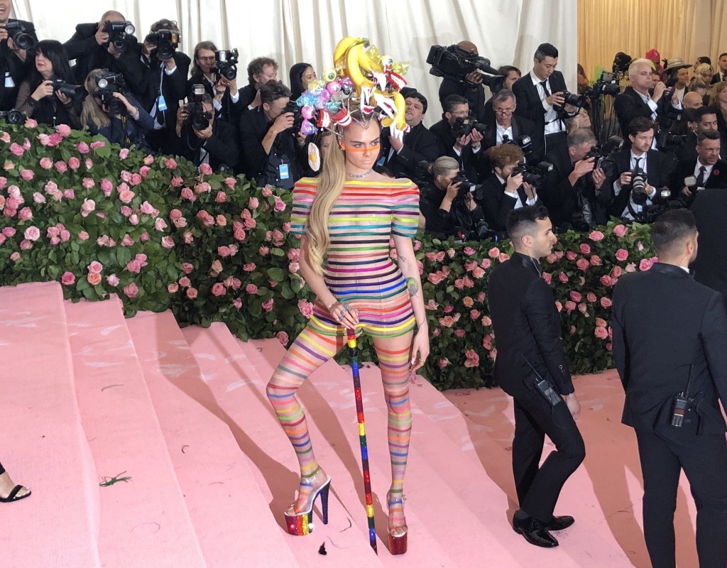 Cara Delevingne shows off her campy ensemble for the MetGala