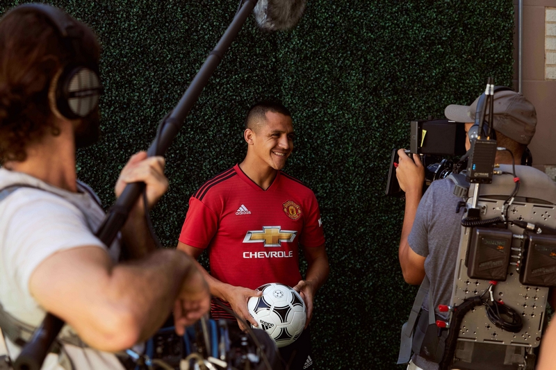 Manchester United forward, Alexis Sanchez, smiles down the lens during a Chivas film shoot in July in Los Angeles, United States