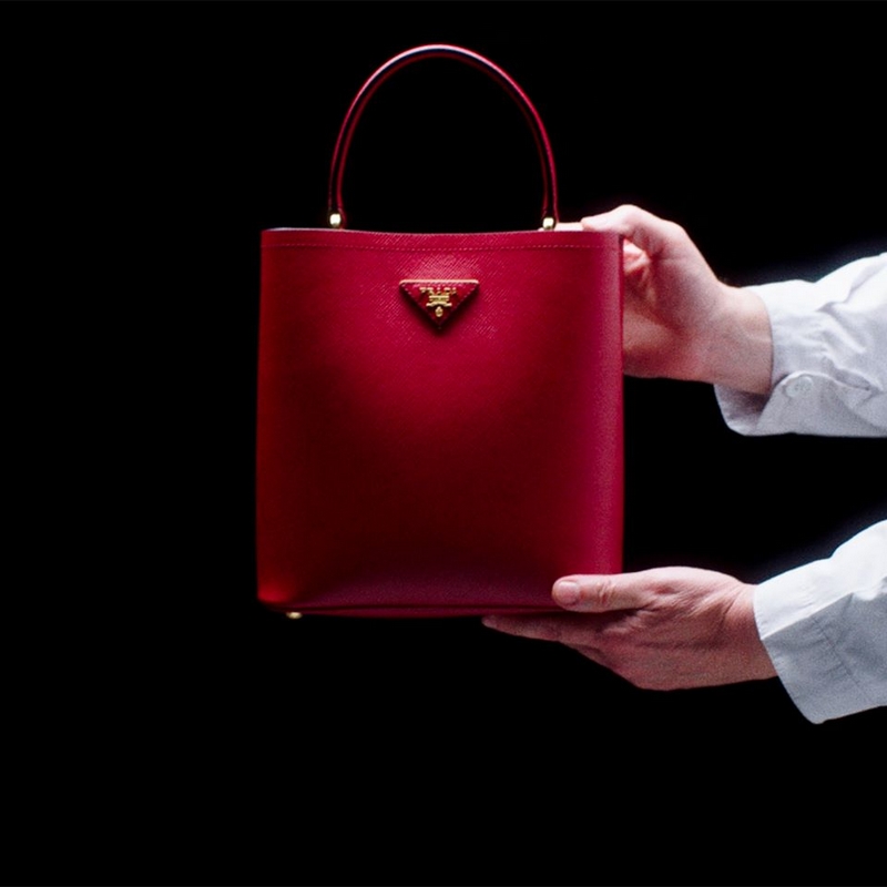 The Prada Panier bag’s minimalist design is enhanced by sophisticated details